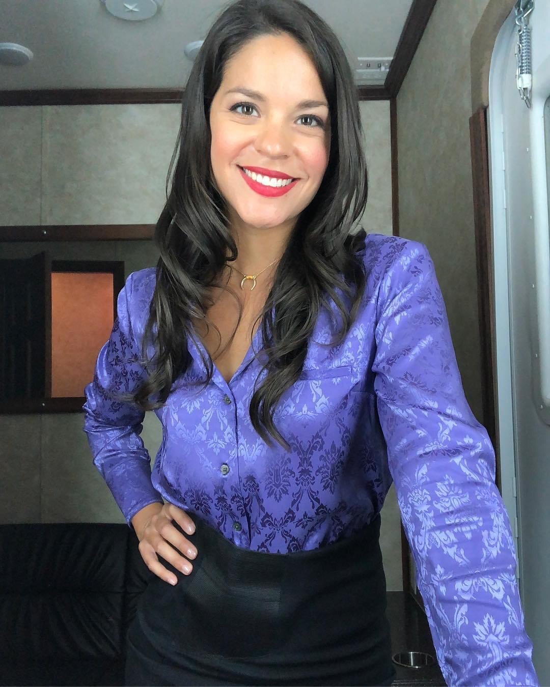 Eva Avila smiling behind the scenes